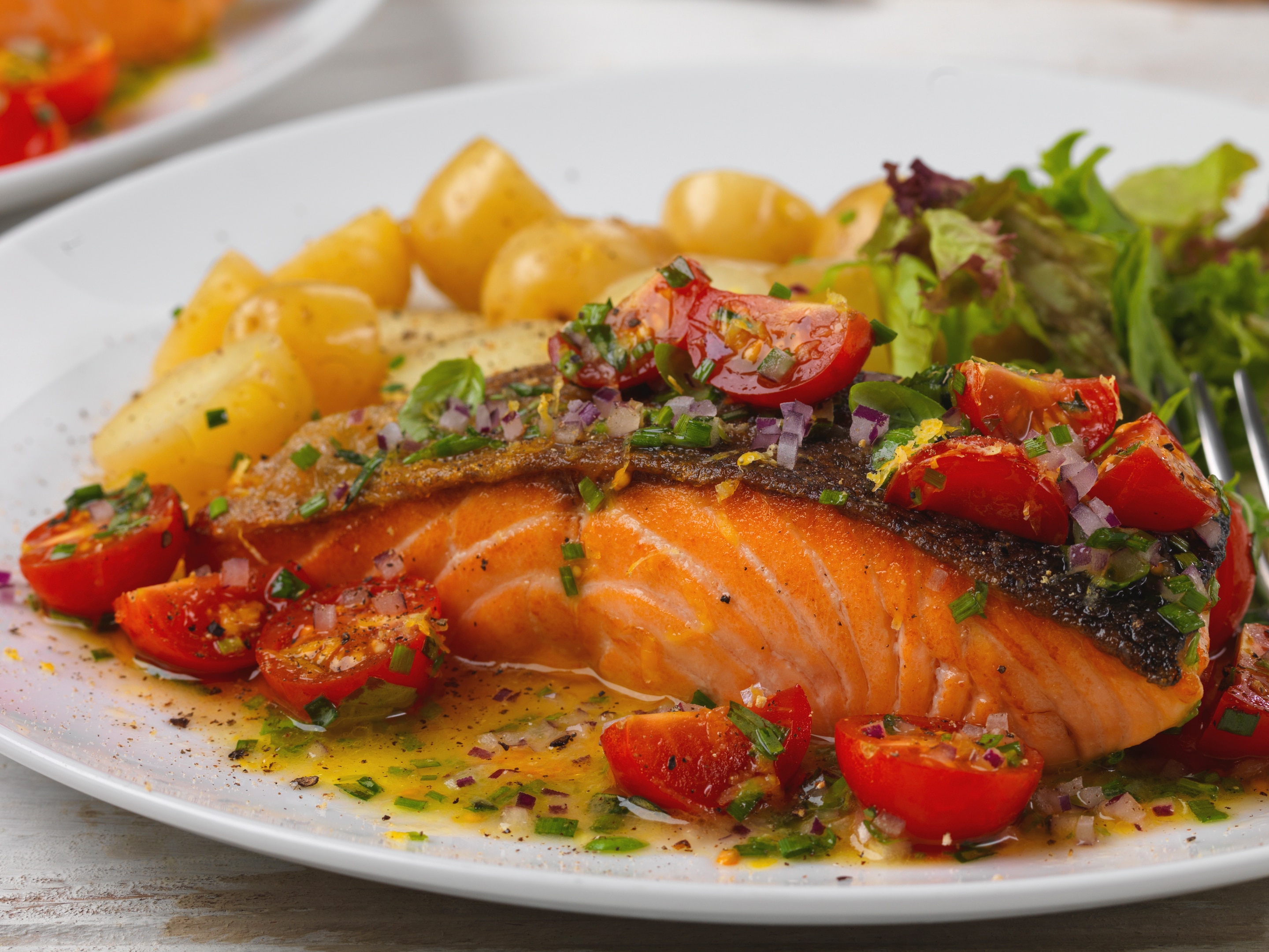 Pan fried salmon with tomatoes and fresh herb vinaigrette