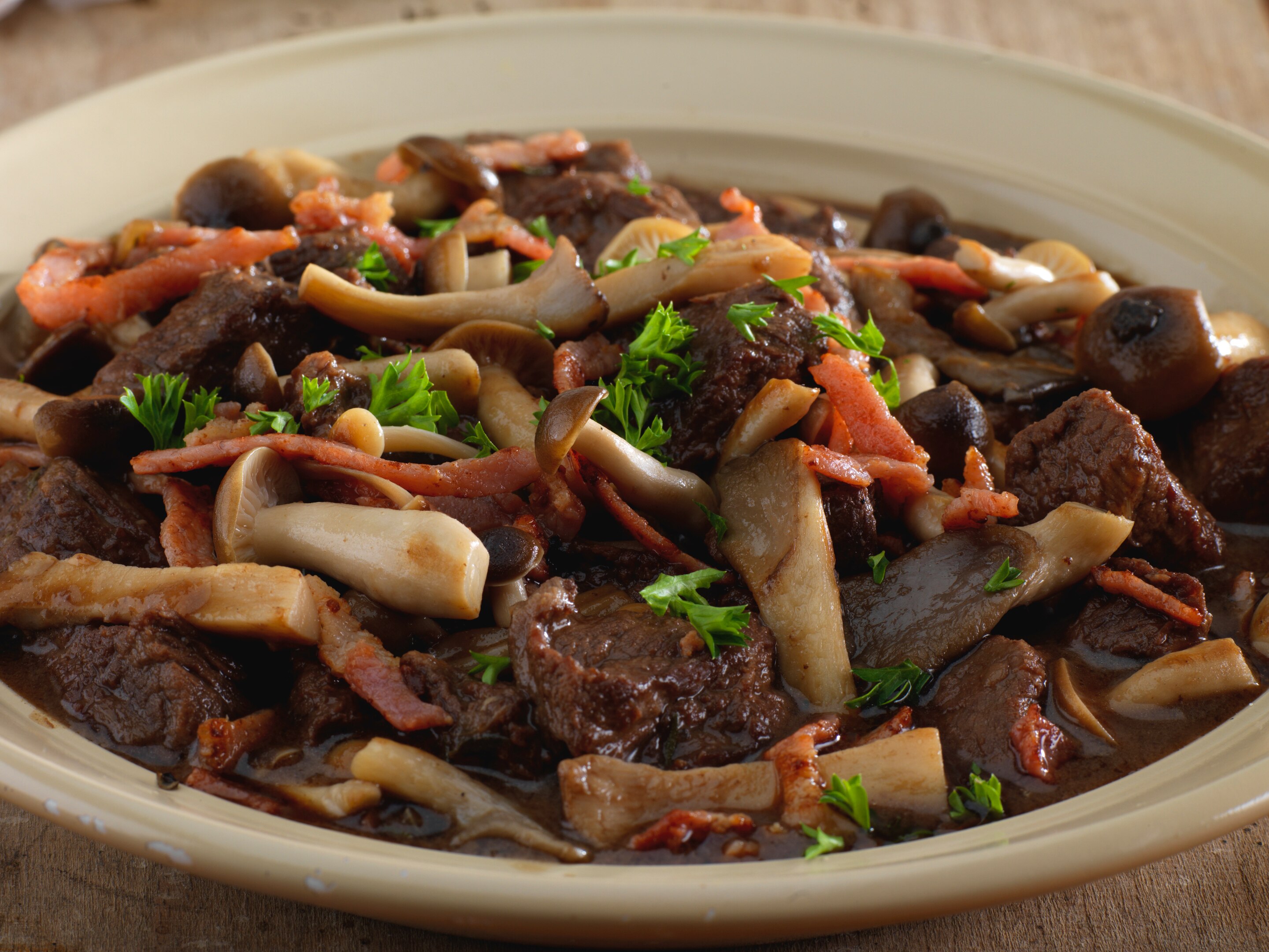 Beef bourguignon in mushrooms and red wine sauce