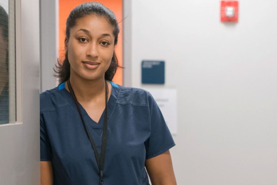 Femalte doctor standing on a corridor indoors