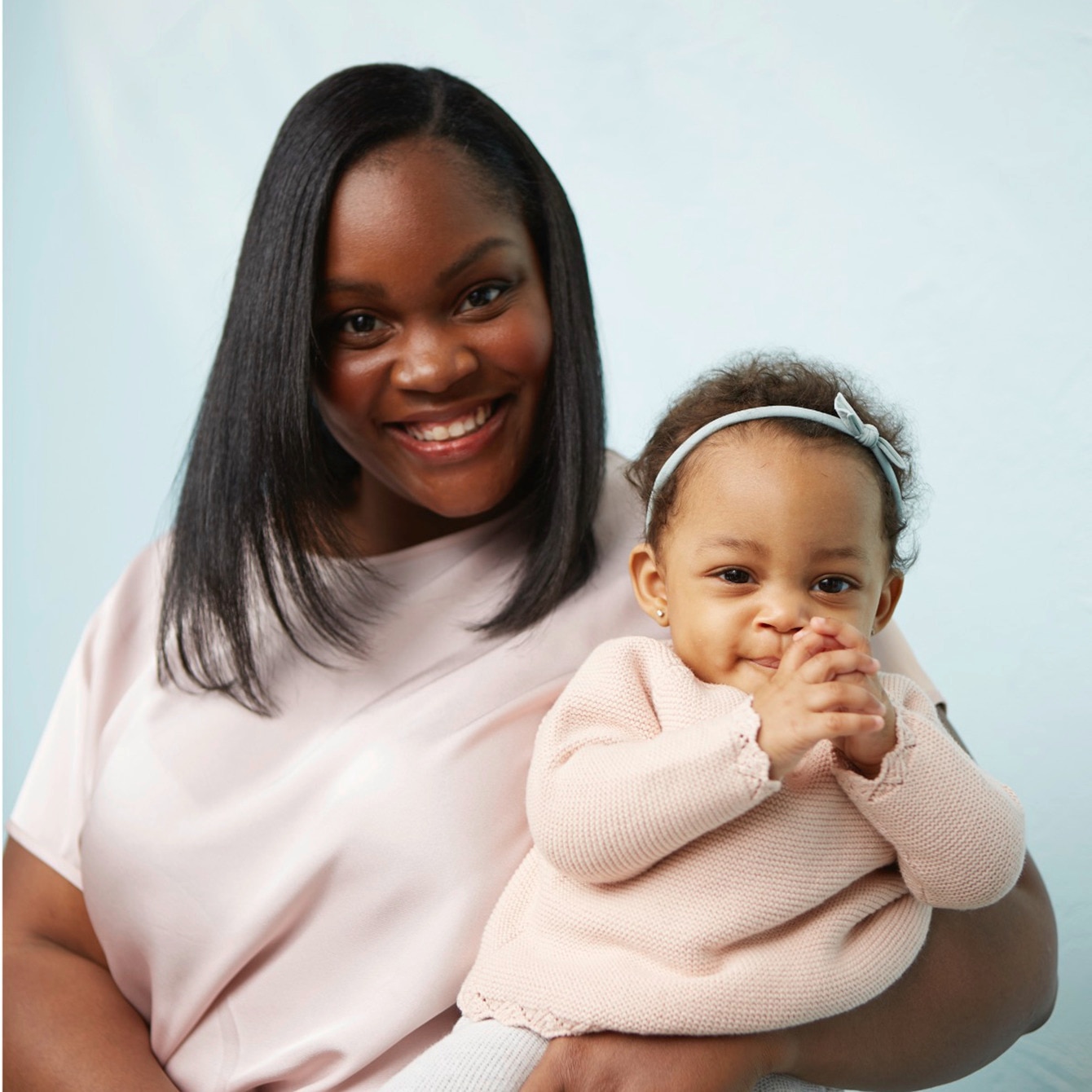Mother Holding her baby taking a photo