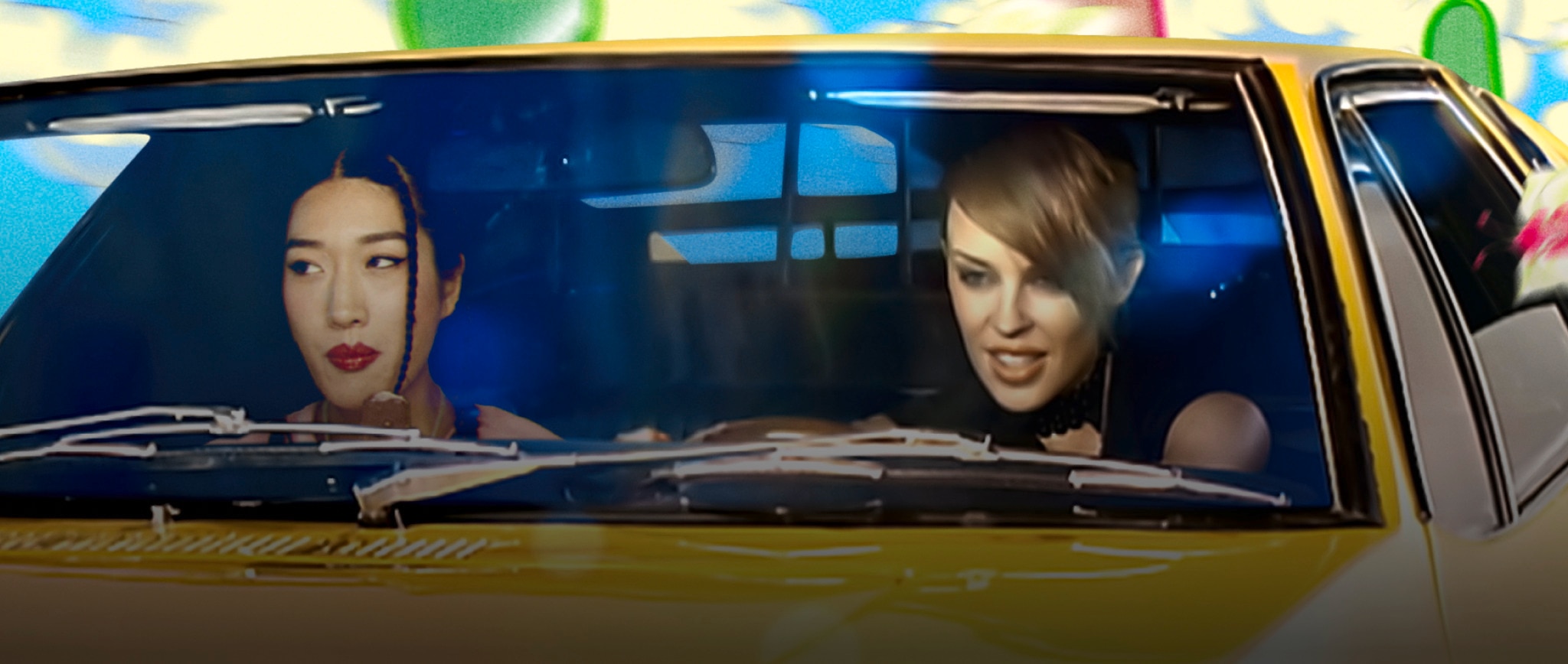Peggy Gou & Kylie Minogue inside iconic yellow car