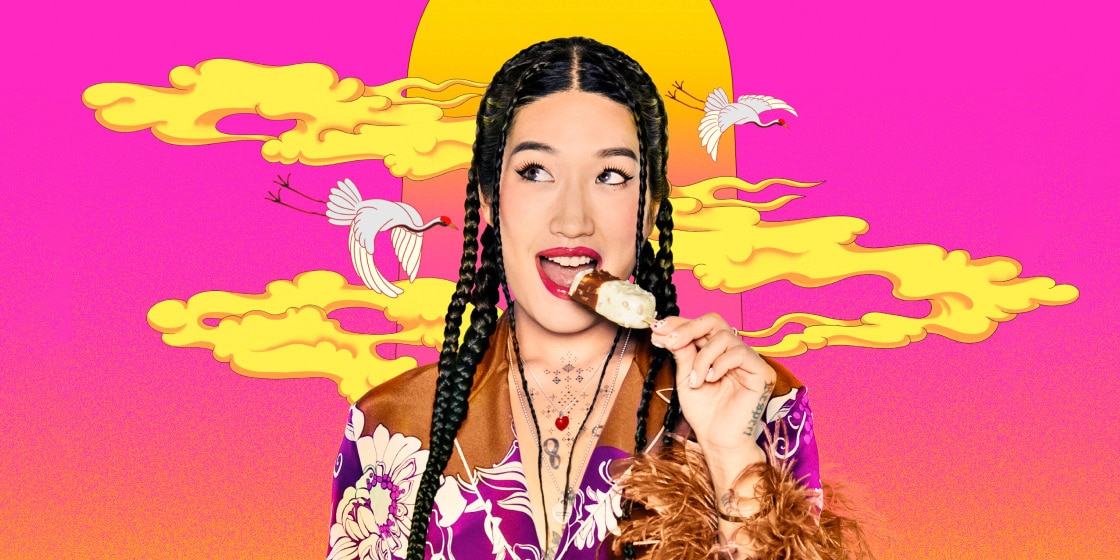 Peggy Gou, on a colourful background, biting into a Magnum Almond Remix