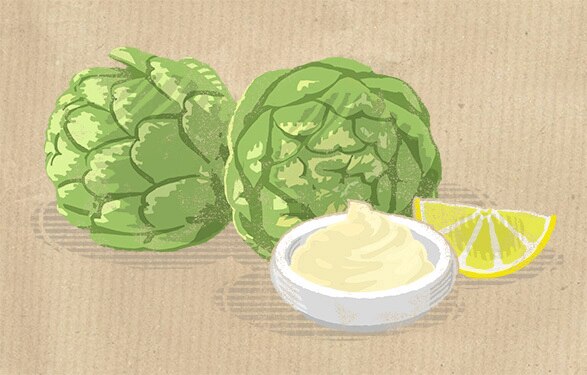 two artichokes and sauce