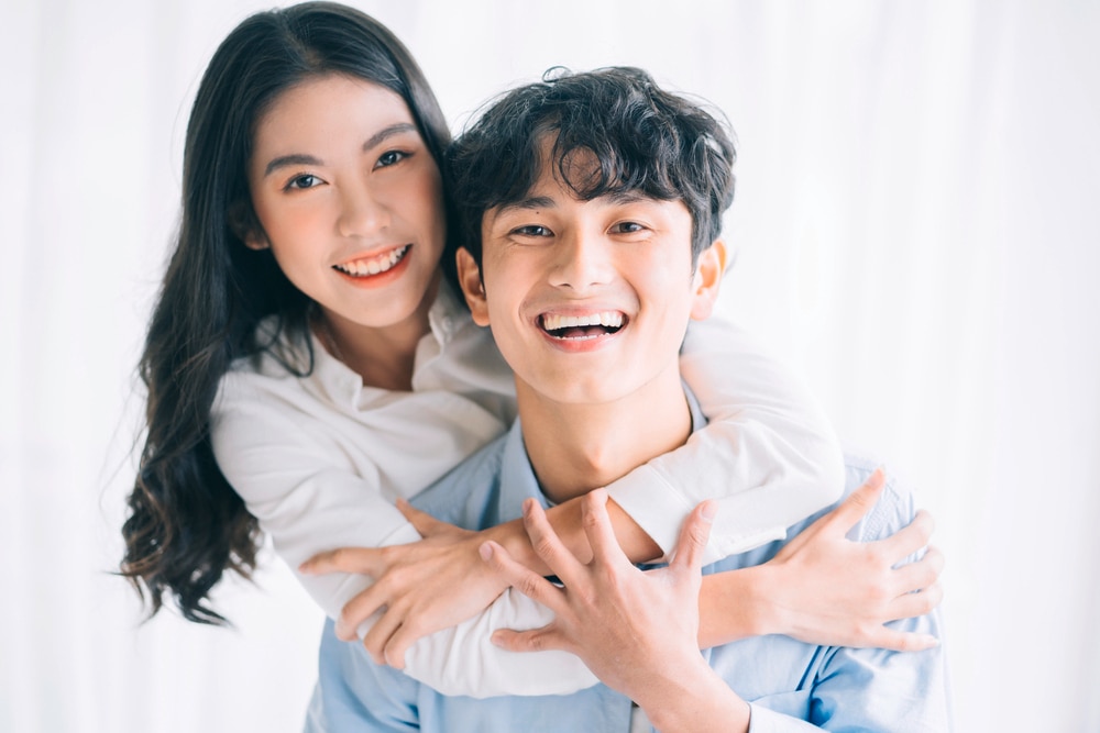 Asian couple looking powerful and happy