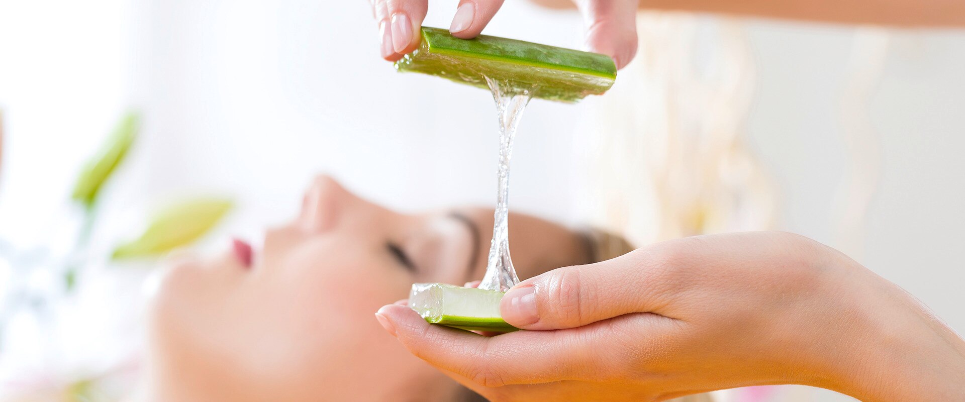 Lady holding aloe vera gel in her hands
