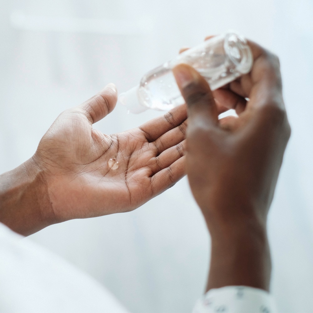 Close up hands of applying sanitizer