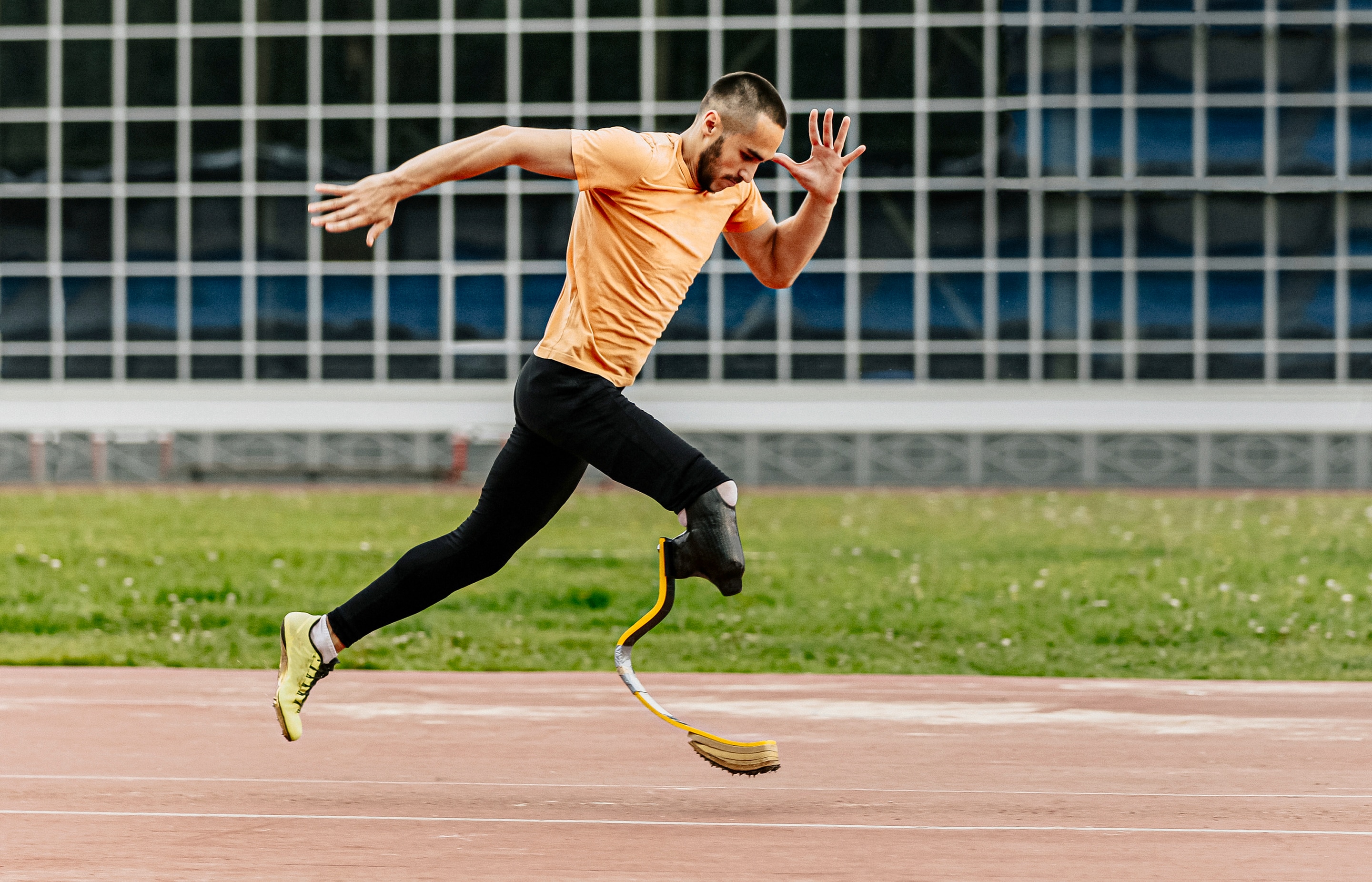 Paralympian sprinter training hard on the running track. 