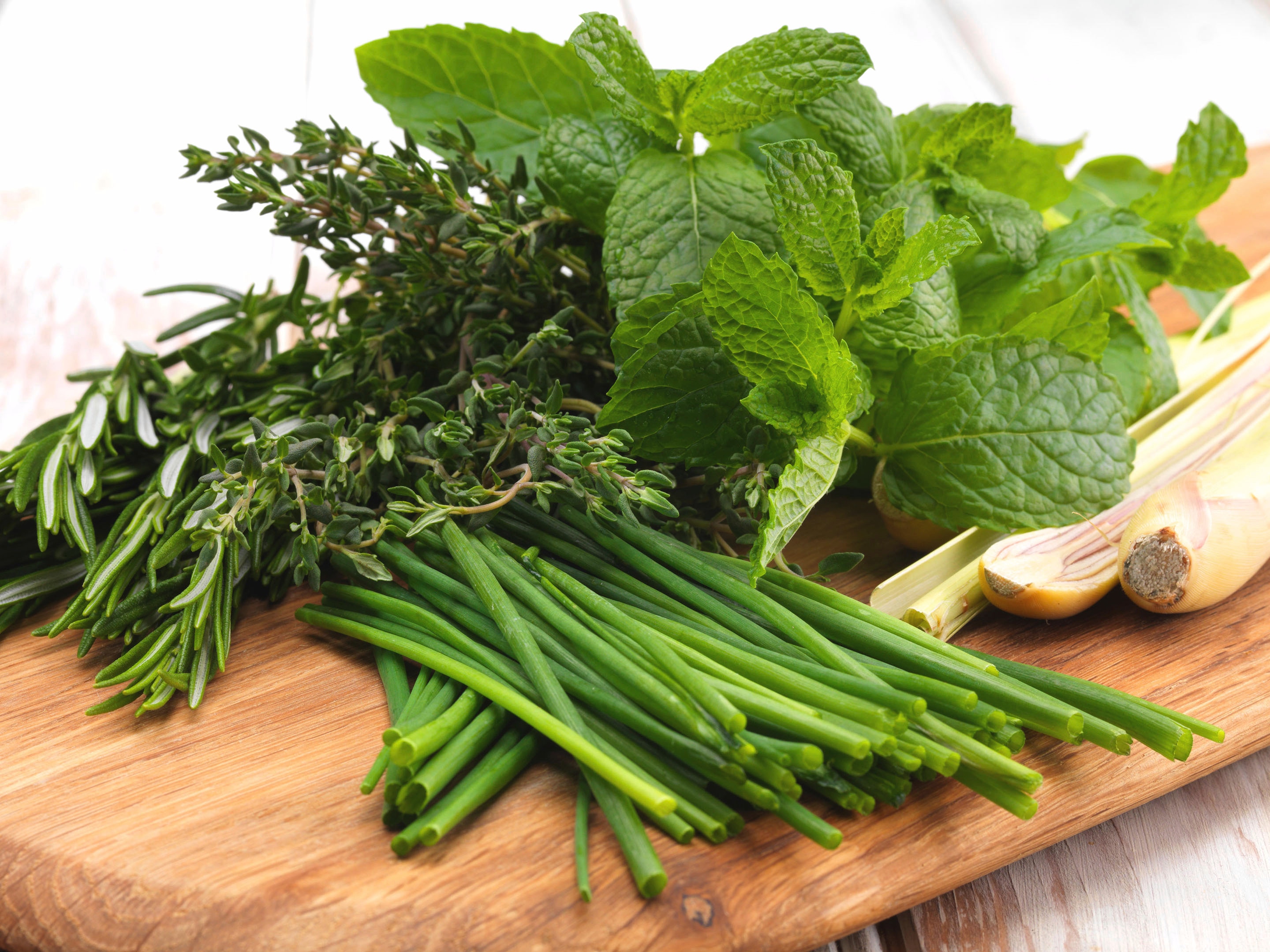Selection of fresh herbs on a chopping board