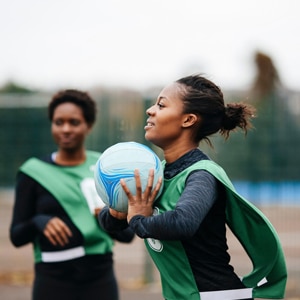 Pretty girl behind plant
