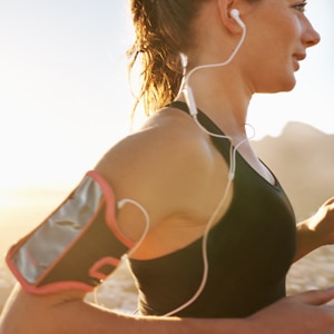 Lady running with earphones in.