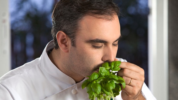 man smelling vegetable