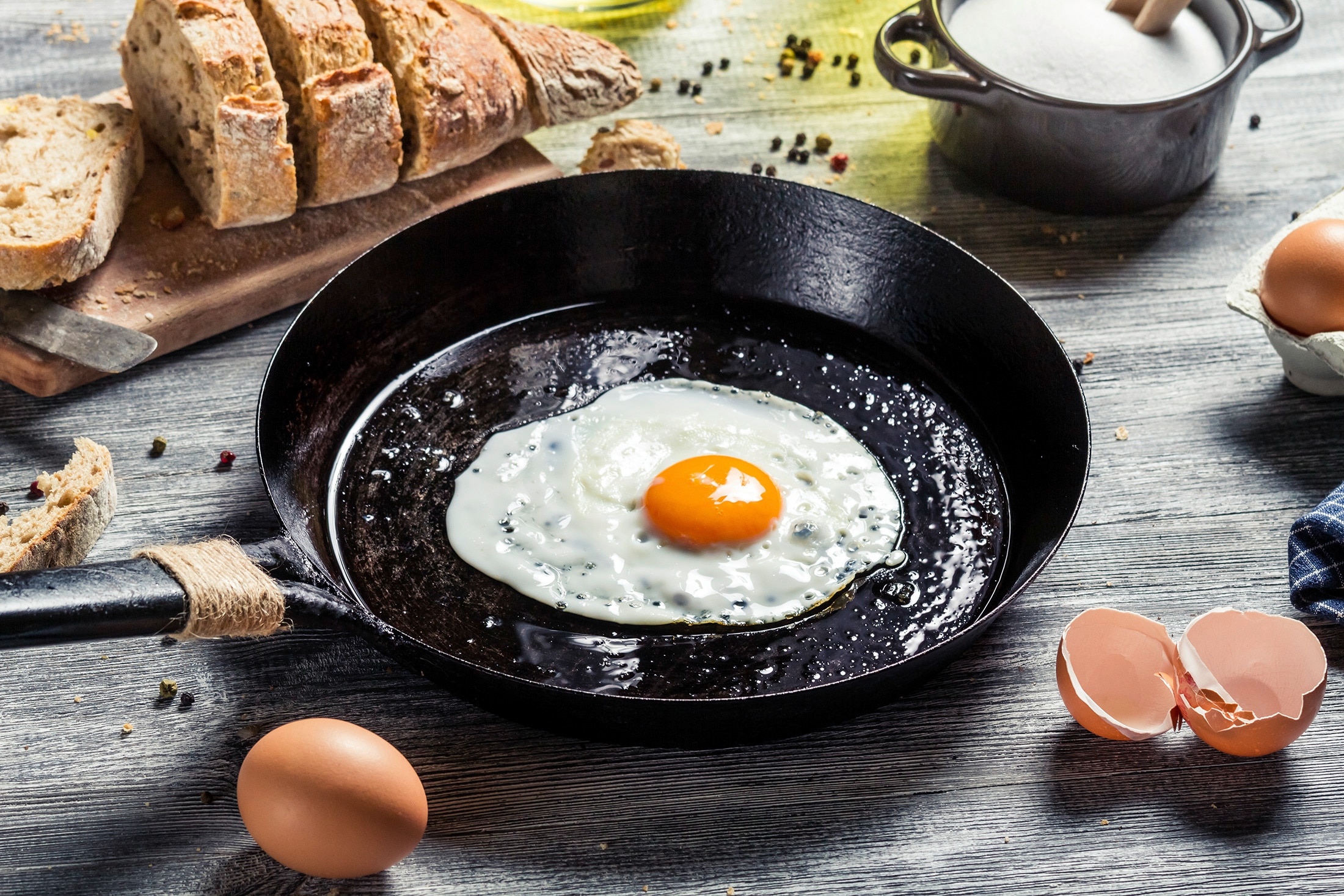 A skillet with a fried egg in oil